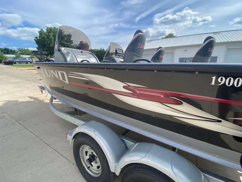 Slide: The Image of 2007 Lund 1900 Pro V SE boat on trailer, dual console, sleek design. - 12