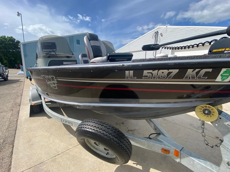 Slide: The Image of 2007 Lund 1900 Pro V SE boat on trailer, dual console, black exterior. - 15