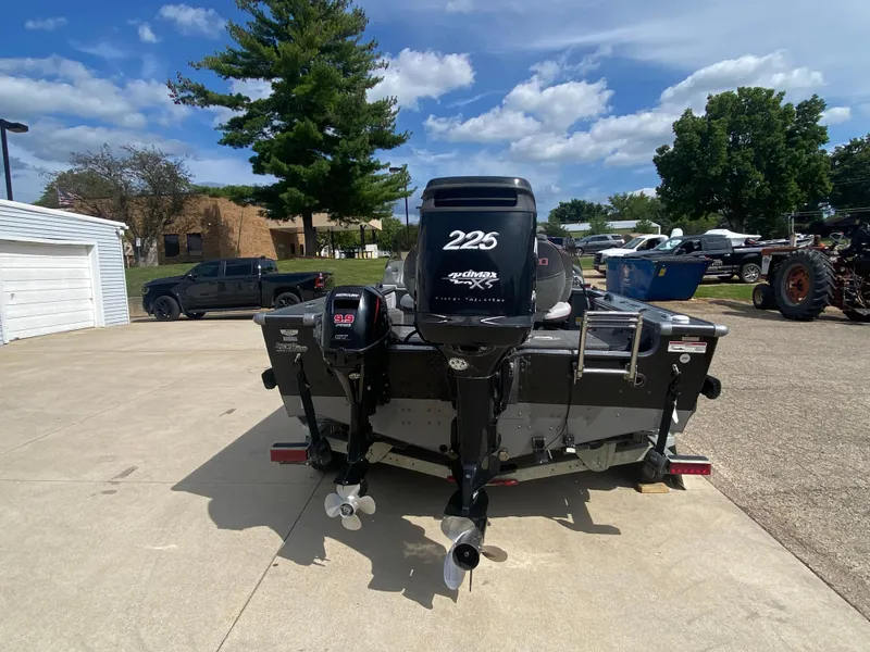 Slide: The Image of 2007 Lund 1900 Pro V SE boat with dual console, parked outdoors. - 3