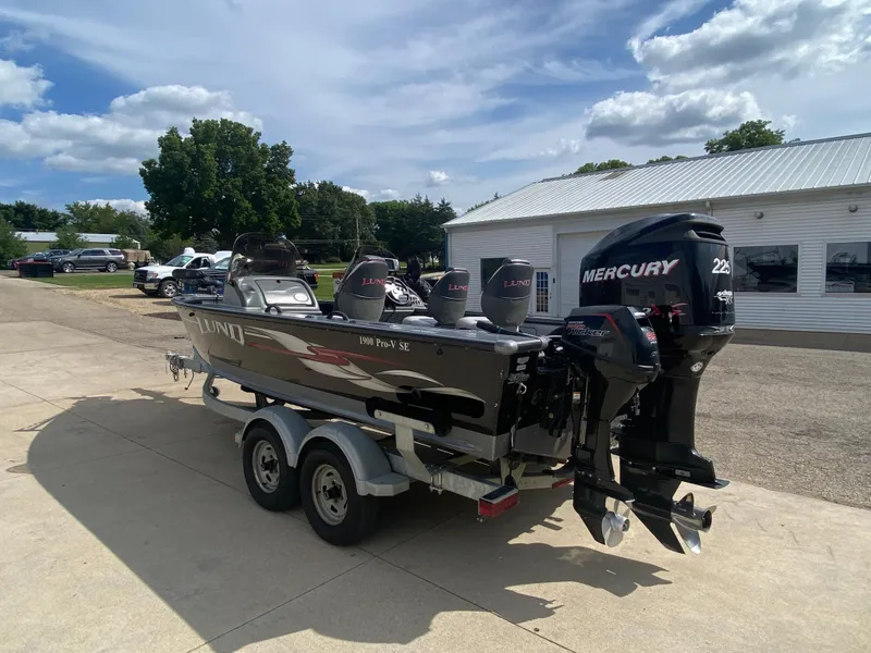 Slide: The Image of 2007 Lund 1900 Pro V SE boat with dual Mercury engines on trailer. - 4