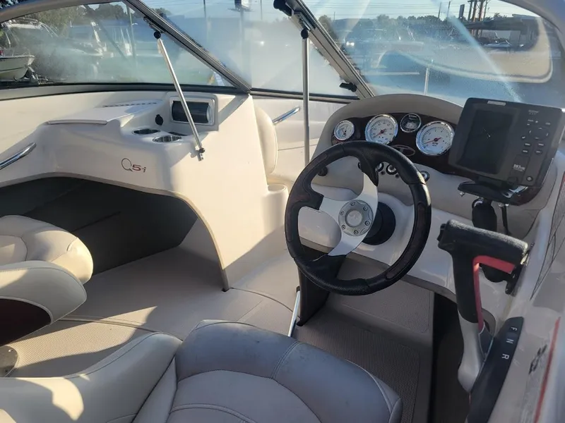 Slide: The Image of 2011 Tahoe Q5i boat interior with steering wheel and dashboard controls. - 5