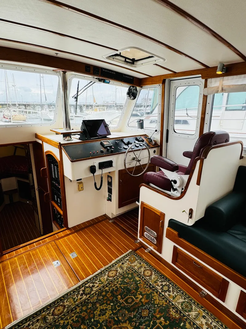 Slide: The Image of Interior of 2000 Holland 38 Downeast Cruiser with wood accents and nautical decor. - 10