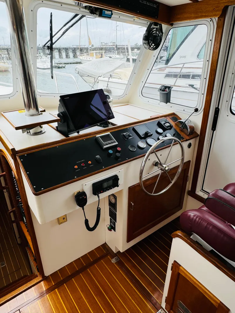 Slide: The Image of Interior helm of 2000 Holland 38 Downeast Cruiser with navigation equipment. - 11