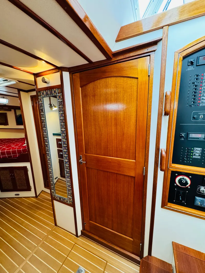 Slide: The Image of Interior of 2000 Holland 38 Downeast Cruiser with wooden door and paneling. - 31