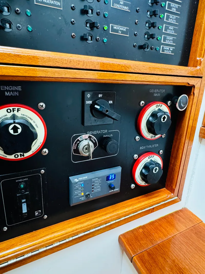 Slide: The Image of Control panel of 2000 Holland 38 Downeast Cruiser with switches and dials. - 39