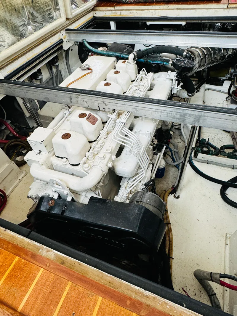 Slide: The Image of Engine compartment of 2000 Holland 38 Downeast Cruiser, showcasing detailed mechanical components. - 42