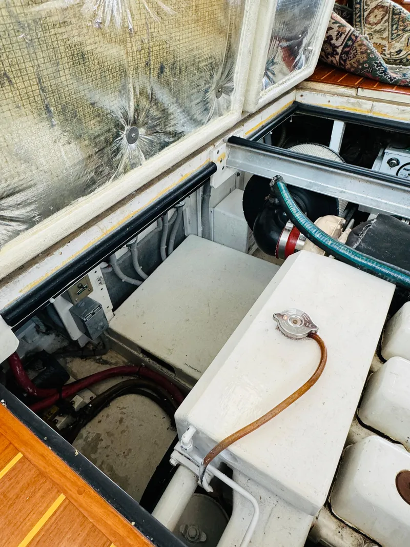 Slide: The Image of Engine compartment of 2000 Holland 38 Downeast Cruiser with visible components and wiring. - 46