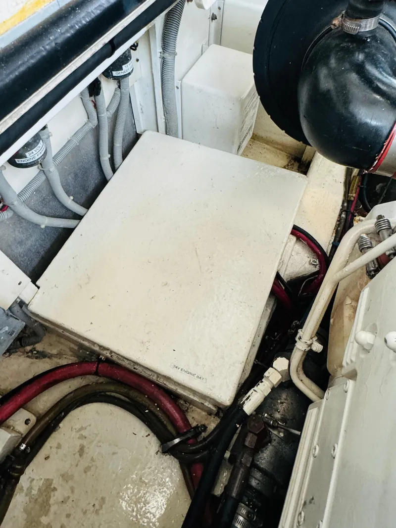 Slide: The Image of Engine room of 2000 Holland 38 Downeast Cruiser with visible wiring and components. - 47