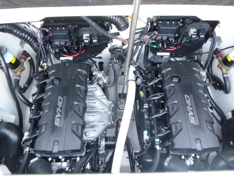 Slide: The Image of 2024 Yamaha Boats 255XE engine compartment with twin SVHO engines. - 12