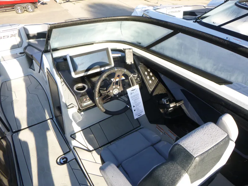 Slide: The Image of 2024 Yamaha Boats 255XE cockpit with steering wheel and control panel. - 7