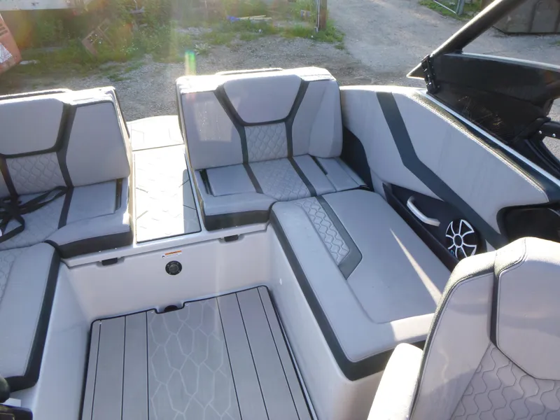 Slide: The Image of 2024 Yamaha Boats 255XE interior with stylish gray seating and modern design. - 9