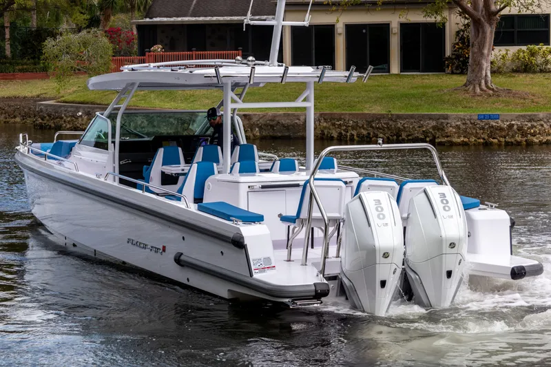 Slide: The Image of 2024 Axopar 37 Sun Top boat with dual engines cruising on a calm waterway. - 22