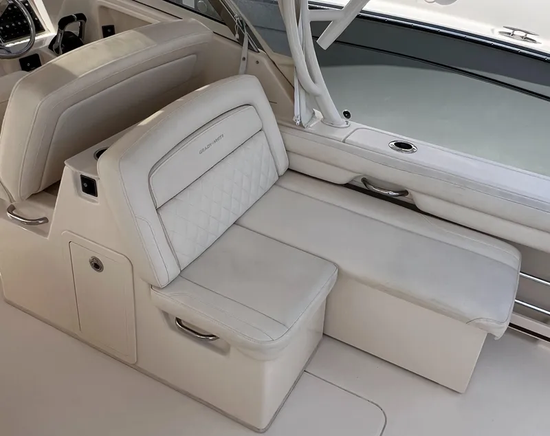Slide: The Image of 2018 Grady-White Freedom 325 boat interior with luxurious white seating and elegant design. - 4
