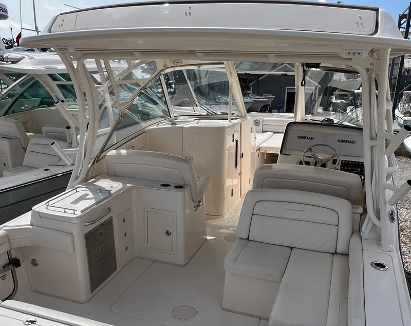 Slide: The Image of 2018 Grady-White Freedom 325 boat interior with seating and helm station. - 5