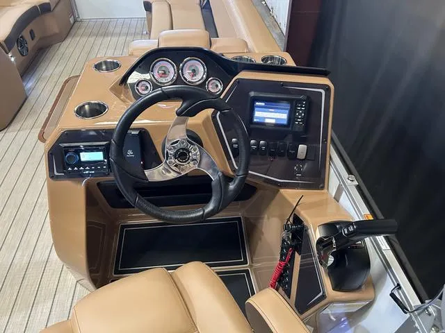 Slide: The Image of 2025 SunCatcher Fusion 322C boat dashboard with Yamaha 200 "SHO" controls and gauges. - 14