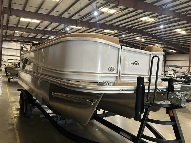 Slide: The Image of 2025 SunCatcher Fusion 322C boat with Yamaha 200 "SHO" engine in a showroom. - 5