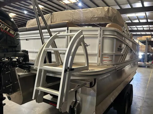 Slide: The Image of 2025 SunCatcher Fusion 322C pontoon boat with Yamaha 200 "SHO" engine in a warehouse. - 6