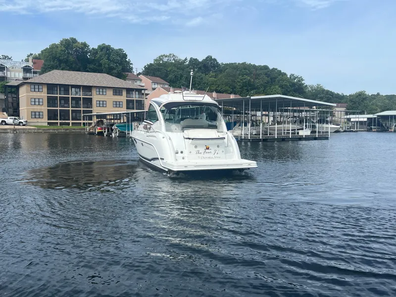 Slide: The Image of 2014 Formula 45 Yacht on a serene lake near waterfront buildings and docks. - 12