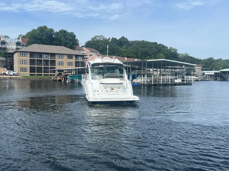 Slide: The Image of 2014 Formula 45 Yacht cruising on a serene lake near waterfront buildings. - 13