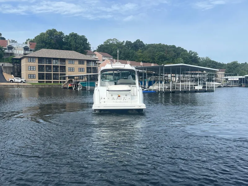 Slide: The Image of 2014 Formula 45 Yacht cruising near waterfront buildings and docks. - 14