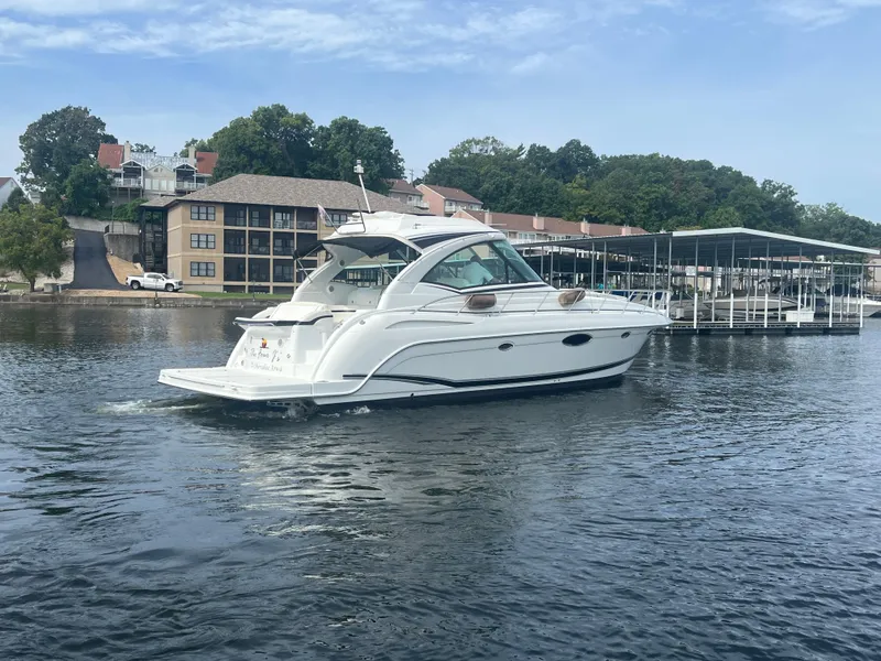 Slide: The Image of 2014 Formula 45 Yacht cruising on a serene lake near a marina. - 17