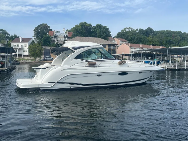 Slide: The Image of 2014 Formula 45 Yacht docked in a marina, surrounded by waterfront homes. - 18