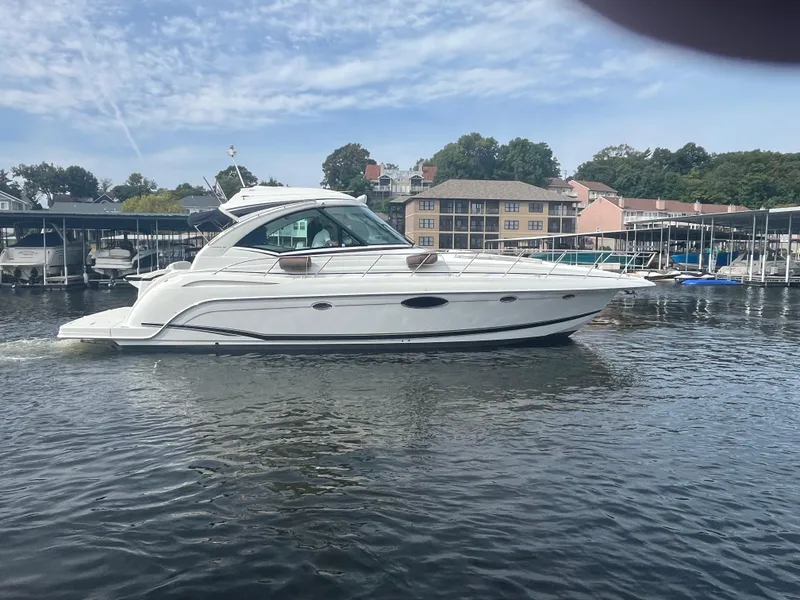 Slide: The Image of 2014 Formula 45 Yacht cruising on a calm river near a marina. - 20