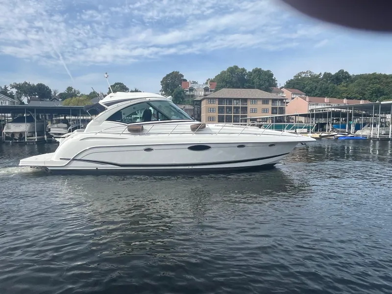 Slide: The Image of 2014 Formula 45 Yacht cruising on a calm lake near a marina. - 21