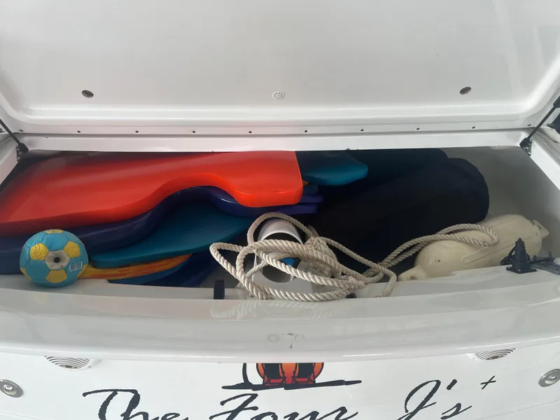 Slide: The Image of Storage compartment of 2014 Formula 45 Yacht with ropes, floats, and a ball. - 24
