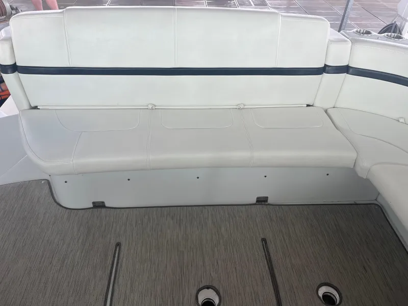 Slide: The Image of 2014 Formula 45 Yacht interior seating with white upholstery and gray flooring. - 26