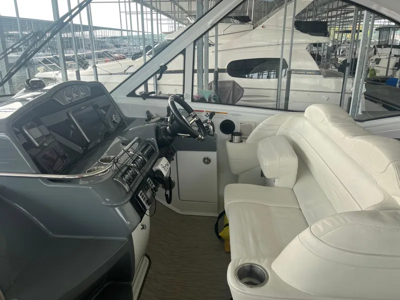 Slide: The Image of Interior of 2014 Formula 45 Yacht with modern helm and white seating. - 32