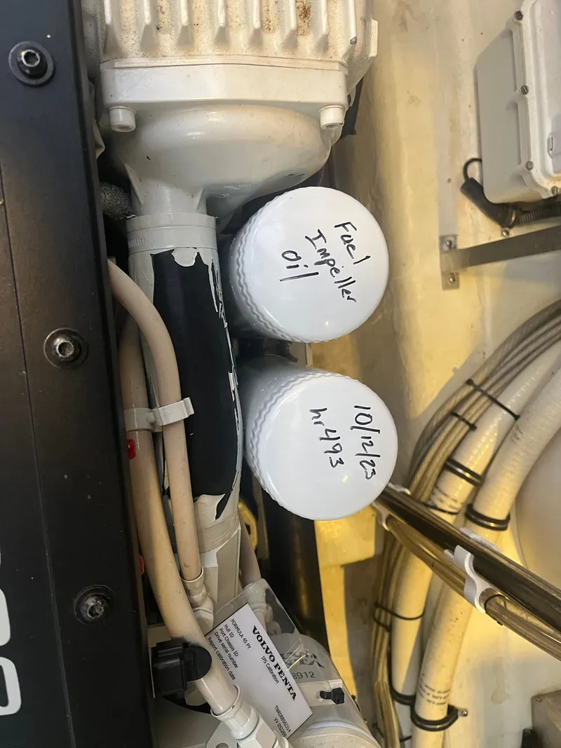 Slide: The Image of Engine components of a 2014 Formula 45 Yacht with labeled oil filters. - 45