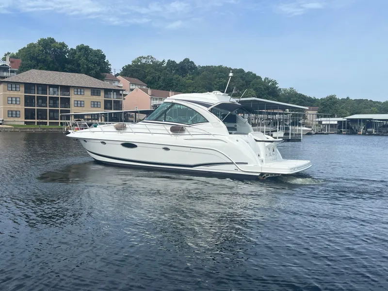 Slide: The Image of 2014 Formula 45 Yacht cruising on a serene lake near waterfront buildings. - 9