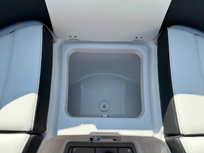 Slide: The Image of 2025 Chaparral 287 SSX boat storage compartment with sleek seating design. - 20
