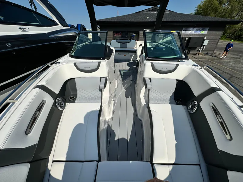 Slide: The Image of 2025 Chaparral 287 SSX boat interior with sleek seating and modern design. - 22