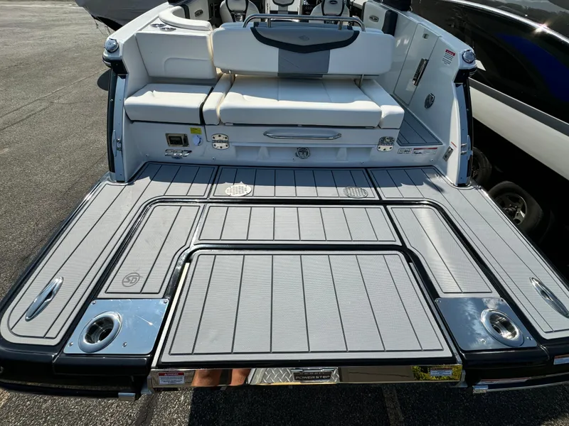 Slide: The Image of 2025 Chaparral 287 SSX boat with spacious rear deck and seating area. - 32