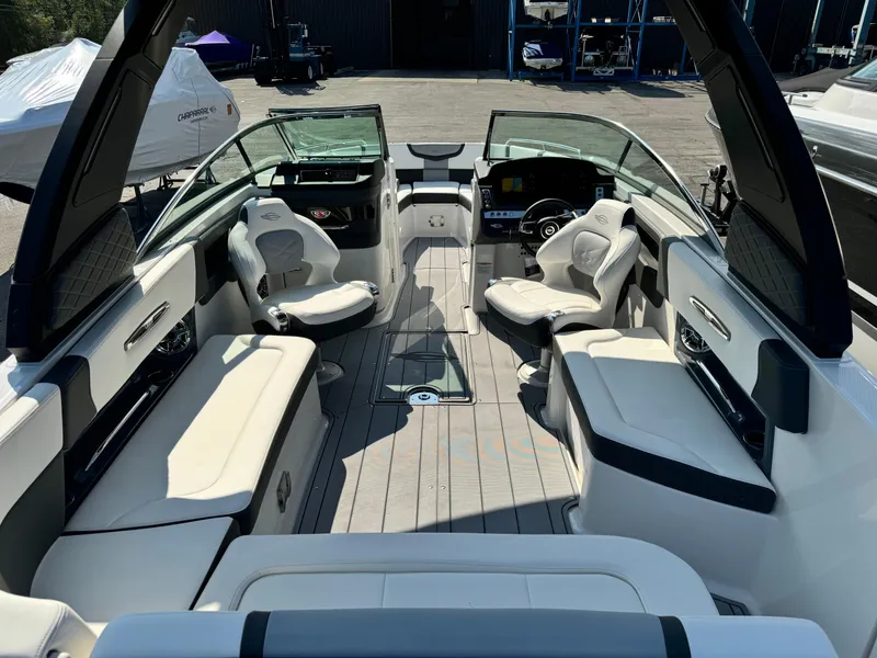 Slide: The Image of 2025 Chaparral 287 SSX boat interior with luxurious seating and modern dashboard. - 36