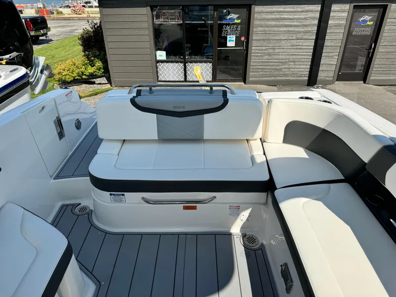 Slide: The Image of 2025 Chaparral 287 SSX boat interior with white seating and modern design. - 37