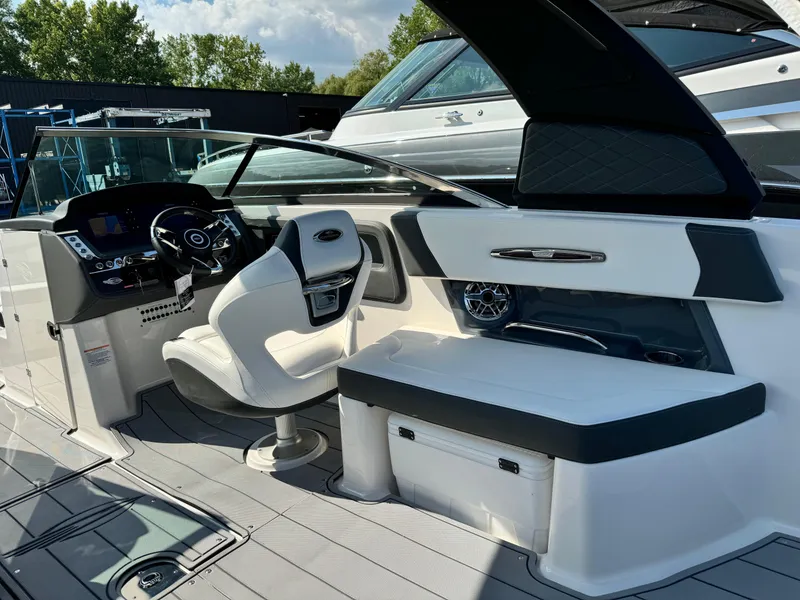 Slide: The Image of 2025 Chaparral 287 SSX boat interior with modern helm and seating. - 41