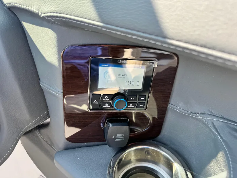 Slide: The Image of 2025 Chaparral 287 SSX boat stereo system with digital display and control panel. - 45