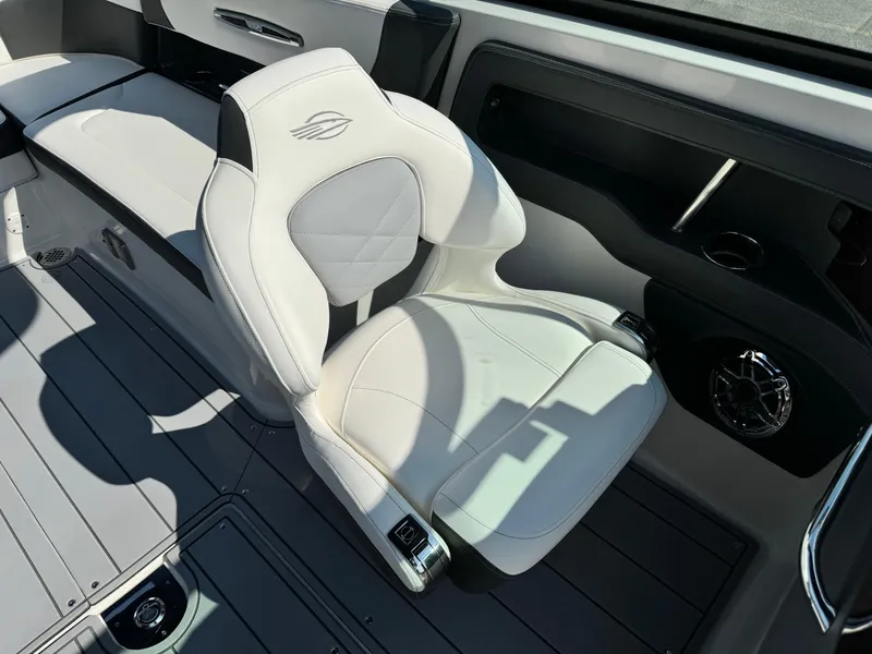 Slide: The Image of 2025 Chaparral 287 SSX boat interior with luxurious white seating and modern design. - 9