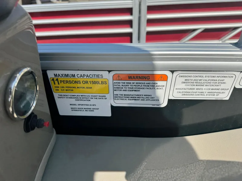 Slide: The Image of Sun Tracker SportFish 22 XP3 2022 capacity label, maximum 11 persons or 1500 lbs. - 12