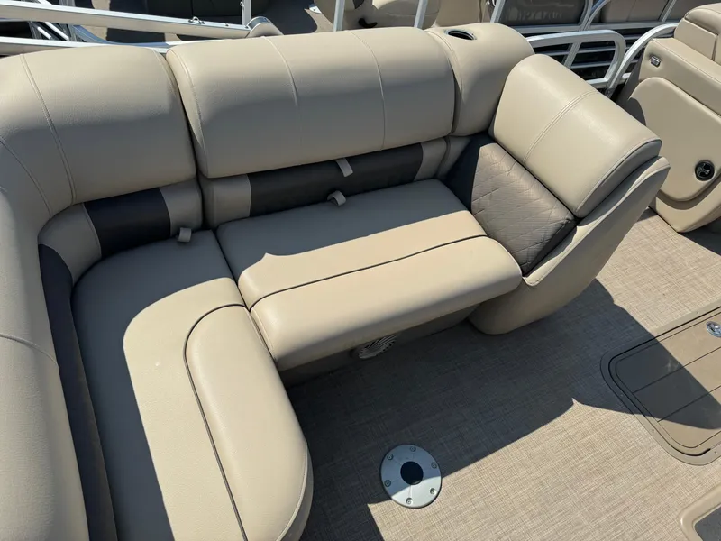 Slide: The Image of 2022 Sun Tracker SportFish 22 XP3 boat interior with beige cushioned seating. - 15