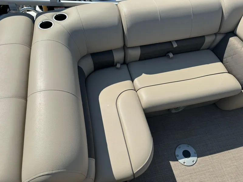 Slide: The Image of Beige seating on 2022 Sun Tracker SportFish 22 XP3 boat with cup holders. - 16