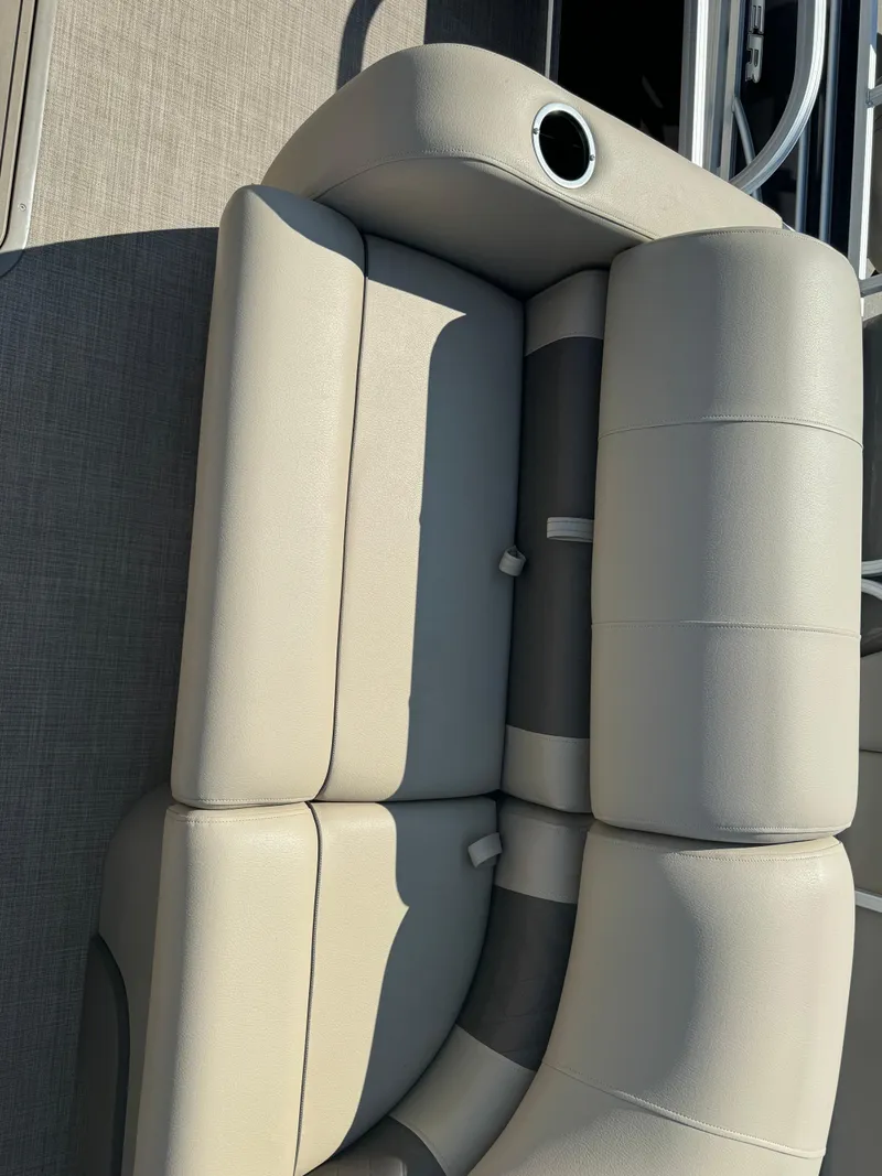 Slide: The Image of 2022 Sun Tracker SportFish 22 XP3 boat seating, beige upholstery, cup holder, and sleek design. - 6