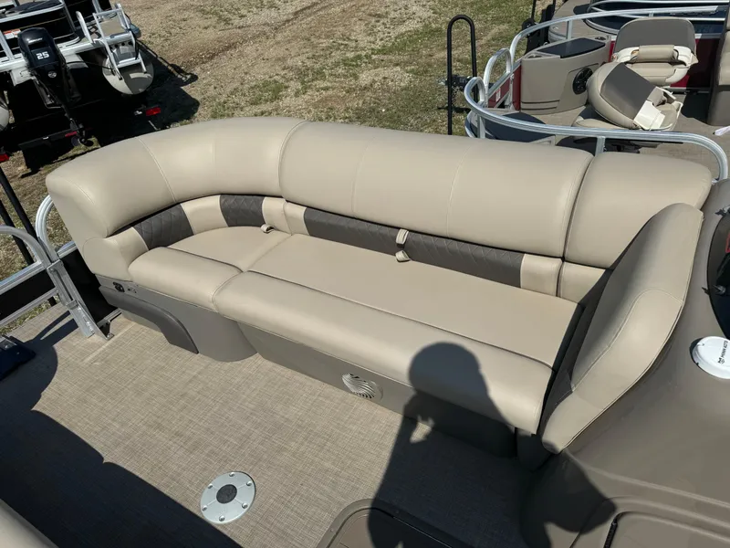 Slide: The Image of 2022 Sun Tracker SportFish 22 XP3 boat with beige seating and spacious deck. - 8