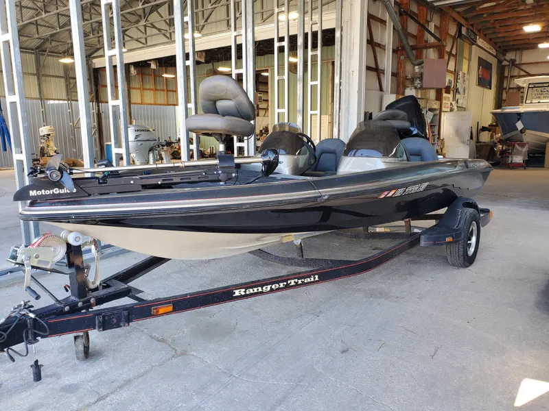 Slide: The Image of 2003 Ranger 185 VX/VS boat on trailer in a warehouse setting. - 0
