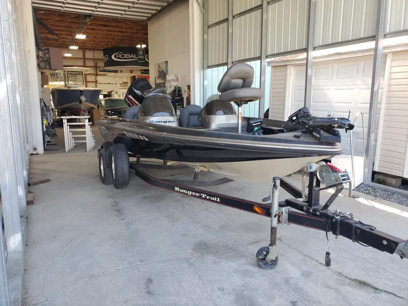 Slide: The Image of 2003 Ranger 185 VX/VS boat on trailer in a garage setting. - 2