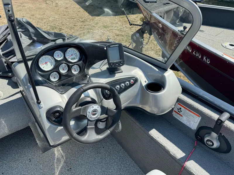 Slide: The Image of 2013 Tracker Pro Guide V-175 Combo boat dashboard with steering wheel and gauges. - 11