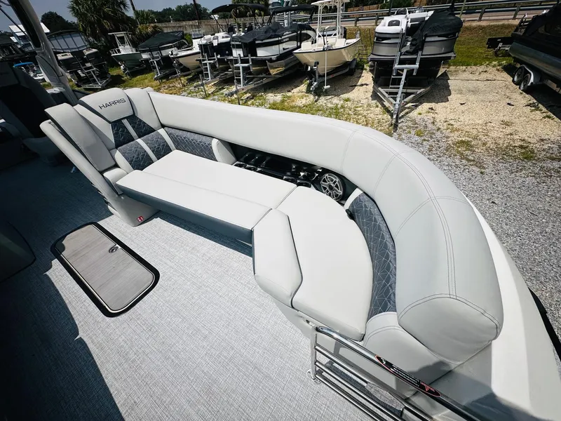 Slide: The Image of 2025 Harris Grand Mariner 250 boat interior with luxurious seating and sleek design. - 13